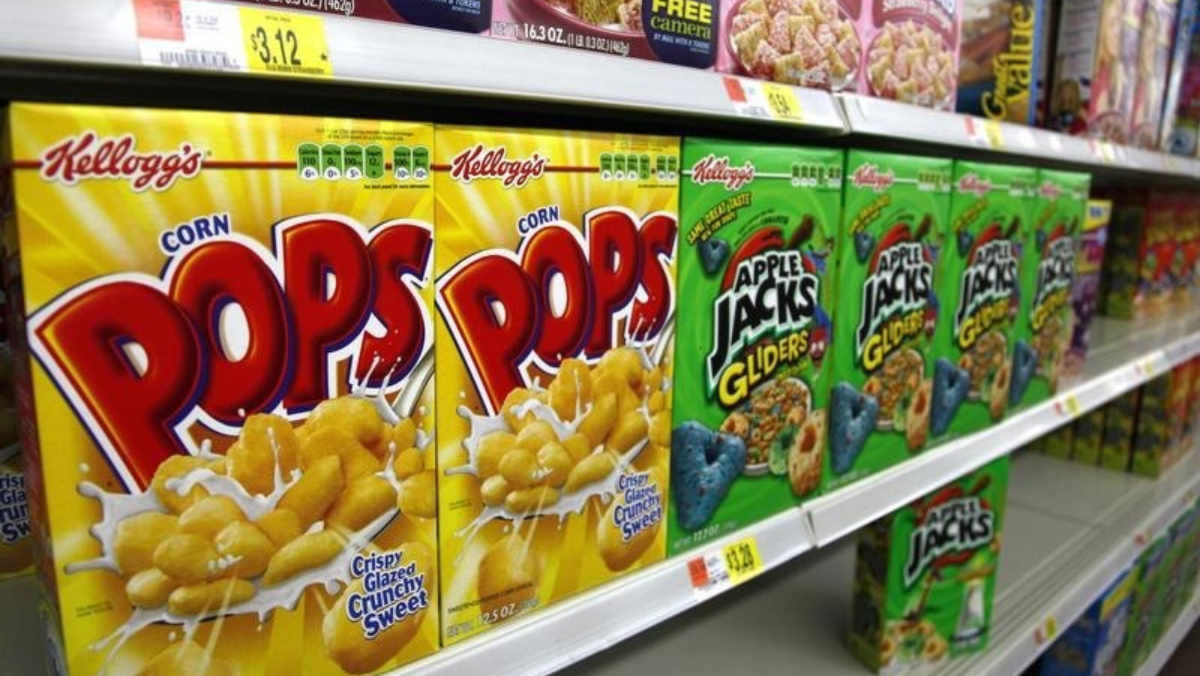 Cereal boxes of Corn Pops and Apple Jacks on a grocery shelf